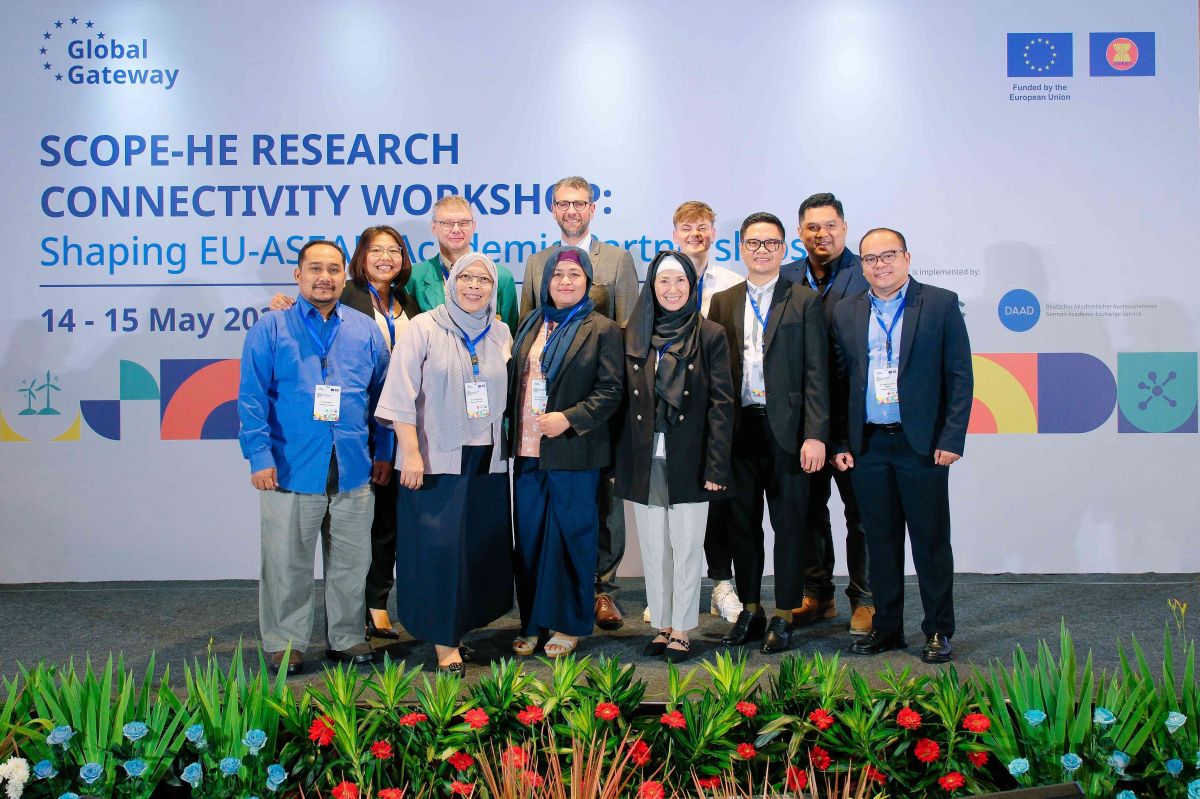 Eleven people in front of a banner (GreenTrans-Edu kickoff meeting in Jakarta)